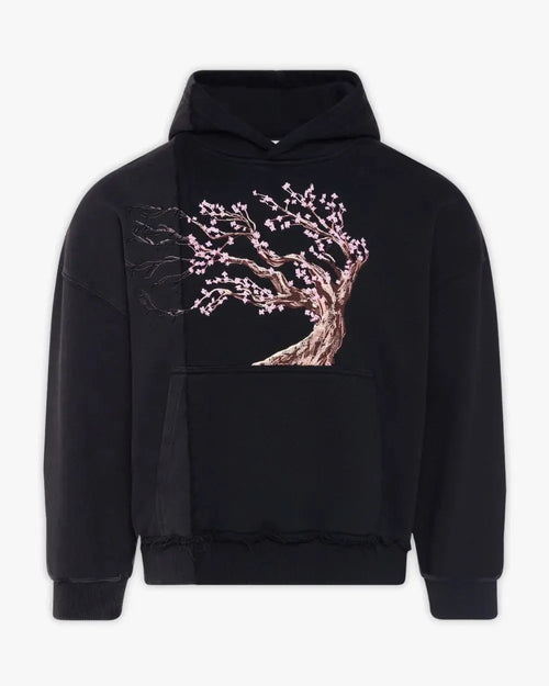 Front view of premium embroidered hoodies featuring a cherry blossom tree design, available in men hoodies and oversized hoodies with a black-to-grey split color fade."